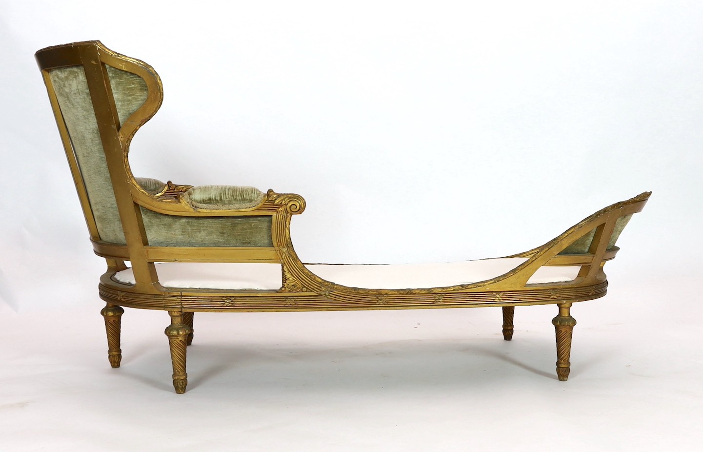 A 19th century Louis XVI style giltwood chaise longue, length 186cm depth 76cm height 95cm